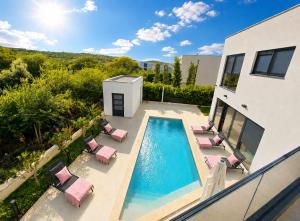 an aerial view of a house with a swimming pool at Vila Volme in Banjole