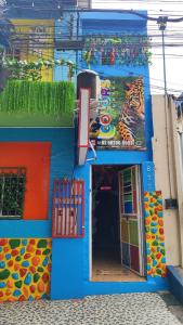a building with a play gym with a tiger painted on it at House of Colors Hotel in Manaus