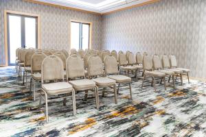a row of chairs in a room with a carpet at Grand Afrosiyob Hotel in Tashkent +32 photos