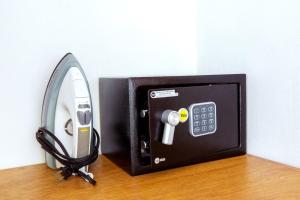 a small appliance with a clock on a table at DELUXE OCEAN view VILLAS & Apartments with POOL - PLAYA LOS CORALES, BBQ, SPA in Punta Cana +27 photos