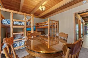 a dining room with a table and bunk beds at Bed-N-Bliss in Kings Beach