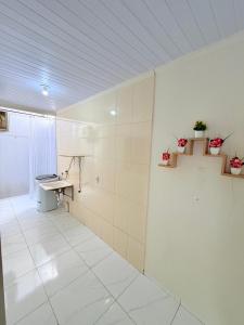a bathroom with a sink and a counter in a room at Apartamento do Graf 2 in Sorriso
