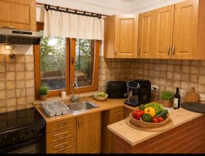 a kitchen with a sink and a bowl of fruit at Apartment A1 Peroj in Peroj +2 photos