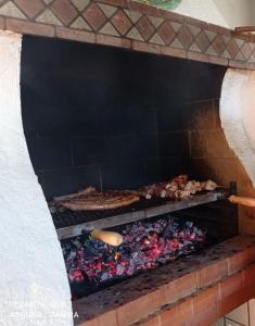 a brick oven with some food in it at Casa Sciavè - Paradise in Sciacca in Sciacca