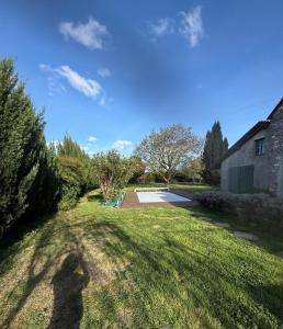 a shadow of a person standing in a yard at Sab in Beaudreix