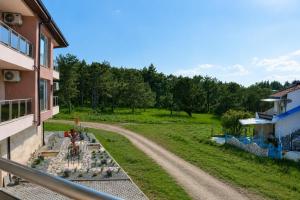 a view from the balcony of a house with a chess game at Blu Riviera Deluxe in Ahtopol