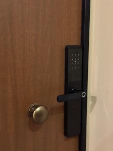 a door with a door knob on it with a lock at Sea & Mount apartament in Shëngjin
