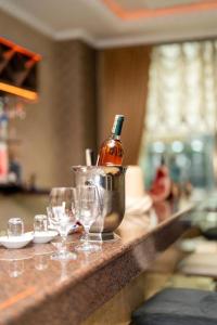 a counter with wine glasses and a bottle on it at Akgun Hotel Beyazit in Istanbul +29 photos