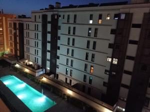 an overhead view of a building with a swimming pool at Ático centro Huelva, parking incluido in Huelva