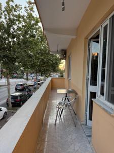a bar on the balcony of a building at Vogli's House Apartments & Rooms in Durrës