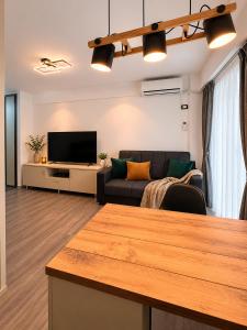 a living room with a couch and a television at Asi Marine Rentals in Saturn