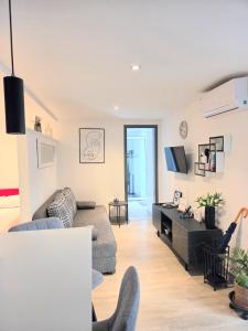 a living room with a couch and a desk at Apartman NONO in Splitska +38 photos
