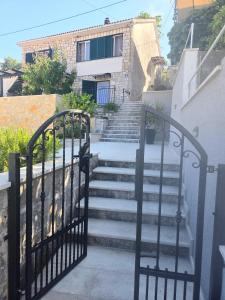 a set of stairs leading up to a building at Apartman NONO in Splitska