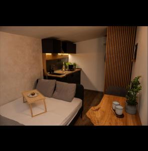 a living room with a white couch and a table at Posed pod hviezdami in Modra