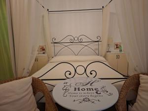 a bedroom with a bed with a sign on it at Morrovalle LOVE in Morrovalle +7 photos