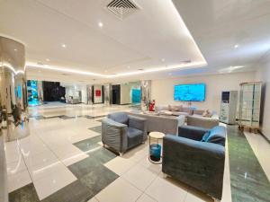 a large living room with couches and a couch at فندق الجنوب Al janob hotel in Riyadh