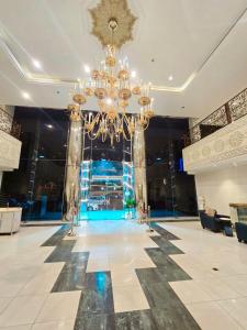 a large lobby with a chandelier in the middle at فندق الجنوب Al janob hotel in Riyadh