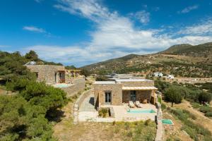 an aerial view of a stone house with a swimming pool at Refoulia Eco Suites in Vathi
