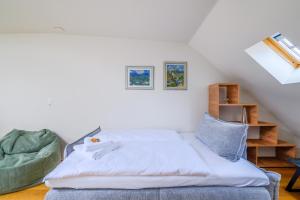 a bed sitting in a room with a stair at Casa Rheinblick - Apartment D in Basel