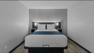 a bedroom with a large bed in a room at Chandigarh Hotel in Chandīgarh