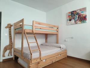a bedroom with a wooden bunk bed with a ladder at La Casa de las Maravillas in Puerto de Mazarrón +77 photos