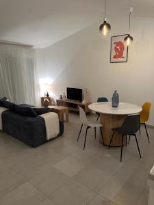 a living room with a couch and a table at Finca Avrafina in Tarascon