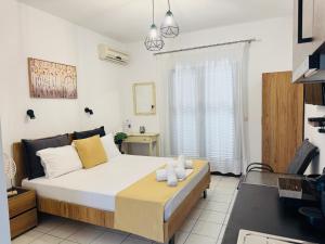 a bedroom with a large bed and a window at Faidrahouse in Alyki
