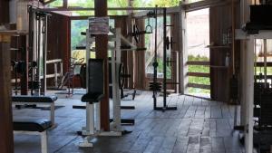 a gym with tread machines in a room at Eco Cabañas Bluekay in Mahahual