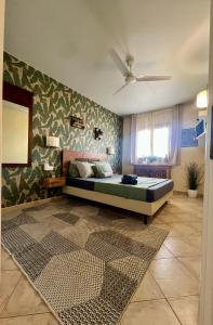 a bedroom with a bed and a window at Tropical Morabeza Apartment Santa Maria in Santa Maria +91 photos
