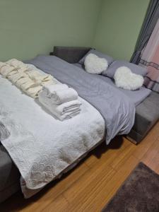 a bed with towels on it in a room at Bella Verde in Vrnjačka Banja +28 photos