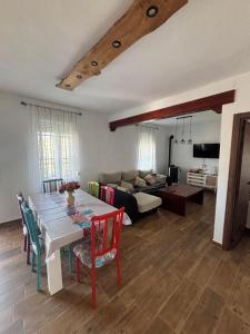 a living room with a table and a couch at El Mirador de Espadan in Alcudia de Veo