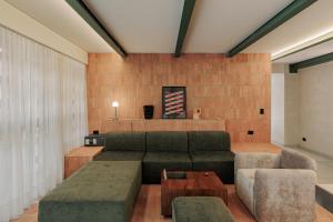 a living room with a couch and a table at Gres Apartments Medellin in Medellín +44 photos