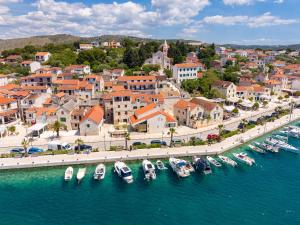 an aerial view of a harbor with boats in the water at Villa ELENA Room Old Town in Rogoznica