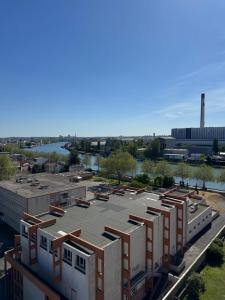 an aerial view of a building in front of a river at Paris-Alfortville in Alfortville