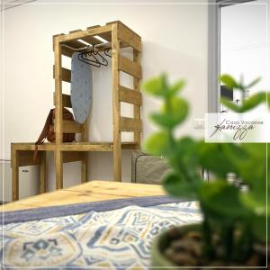 a wooden ladder next to a bed with at Rebecca e Sofia Stone House affittacamere in Alberobello