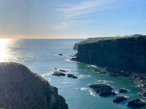 an aerial view of the ocean near a cliff at The Auld Bakehouse in Stonehaven