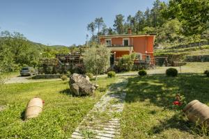 a house in the middle of a grassy field at VILLA EMILY in Framura