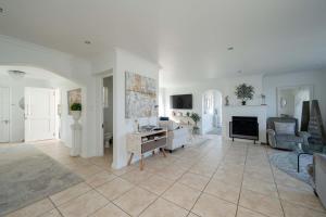 a living room with a couch and a fireplace at Cassa Dunnage At Pezula in Knysna