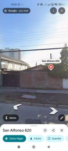 a screenshot of a cell phone with a picture of a building at Casa in Santiago +3 photos