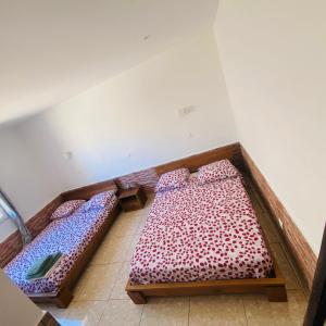 a room with two beds in a room at Le Jardin du soleil in Ifaty