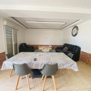 a living room with a table and chairs at Le Jardin du soleil in Ifaty