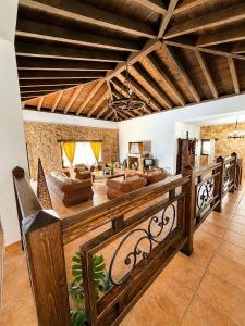 a living room with couches and a couch at Villa El Valle - Piscina climatizada in Tarajalejo