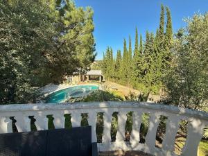 a view of a swimming pool from a balcony at Luna House Sevilla in Guillena