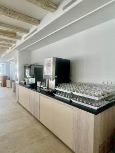 a kitchen with a counter with some food on it at Lago Playa in Es Pujols