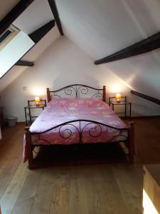 a bedroom with a bed in a attic at Les Six Vallées in Ramillies