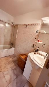 a bathroom with a sink and a shower at Madeira Ocean View in Funchal +13 photos