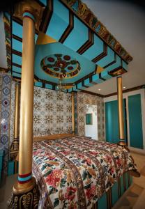 a bedroom with a large bed with a canopy at Milles et une Nuits Sidi Bou in Dar Salah Bey