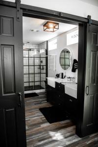 a bathroom with a sink and a mirror at Made with Love in Thackerville