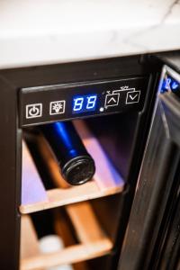 a bottle of wine inside of a microwave oven at Made with Love in Thackerville