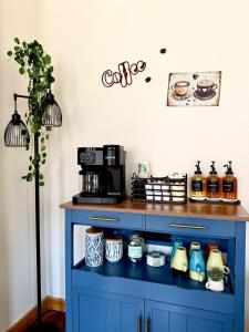 a blue cabinet with a coffee maker on it at Lake Avenue Lofts- Cascade in Duluth